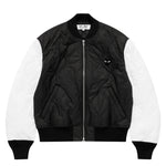 COMME des GARÇONS PLAY quilted bomber jacket in black with white sleeves and black heart logo, front view