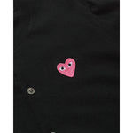 COMME des GARÇONS PLAY black wool cardigan with small pink heart logo, close up